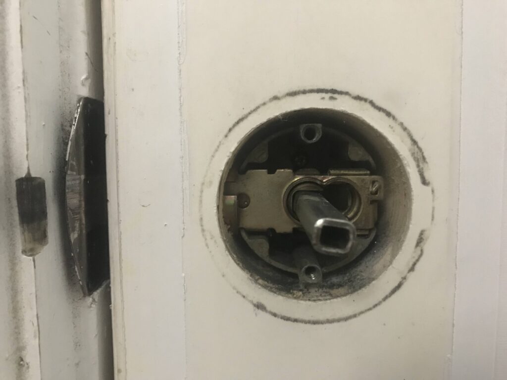 Warning Signs of a Weak Door Lock - My Local Locksmith A damaged residential door lock symbolizing weak home security.