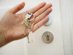 When to Rekey Your Locks Expert Locksmith Advice - My Local Locksmith Locksmith rekeying a residential door lock with precision